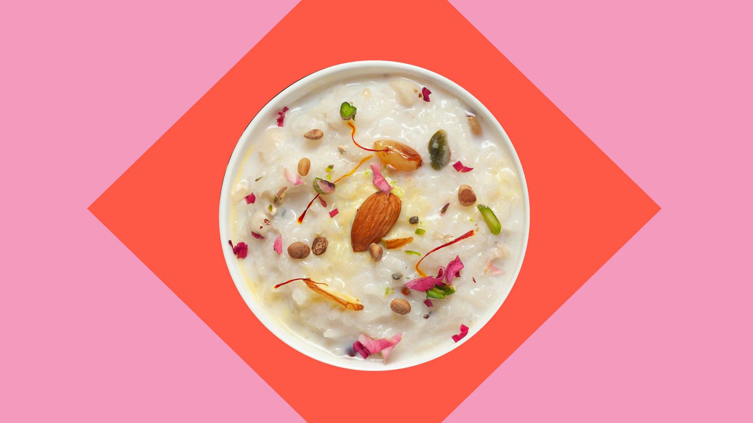 Bowl of rose rice pudding on pink background communal living recipes